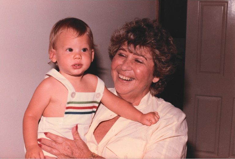 Esther Passy, holding Austin Passy as a child